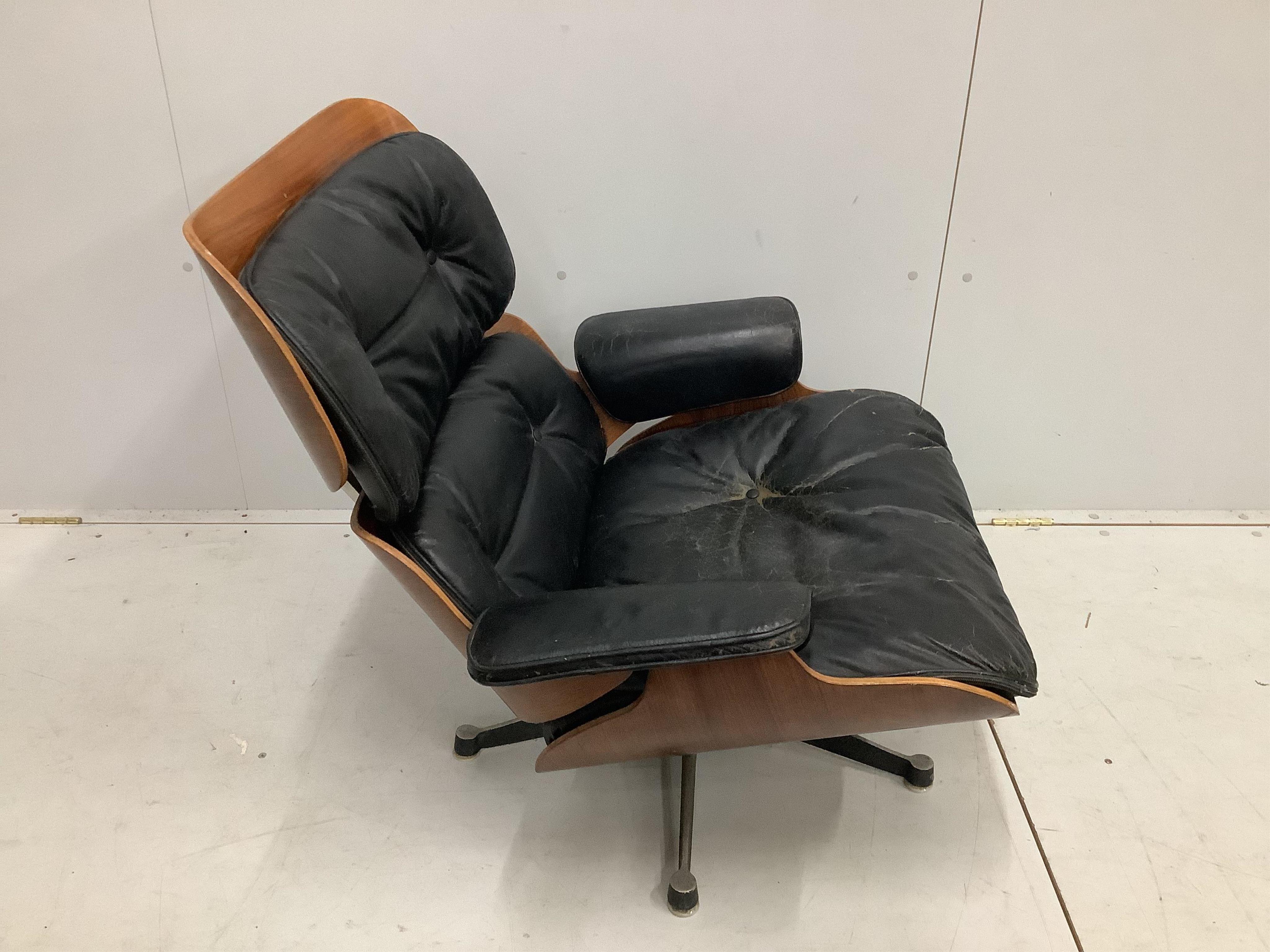 A Charles & Ray Eames for Herman Miller lounge chair, model 670, width 83cm, depth 90cm, height 80cm. Condition - poor